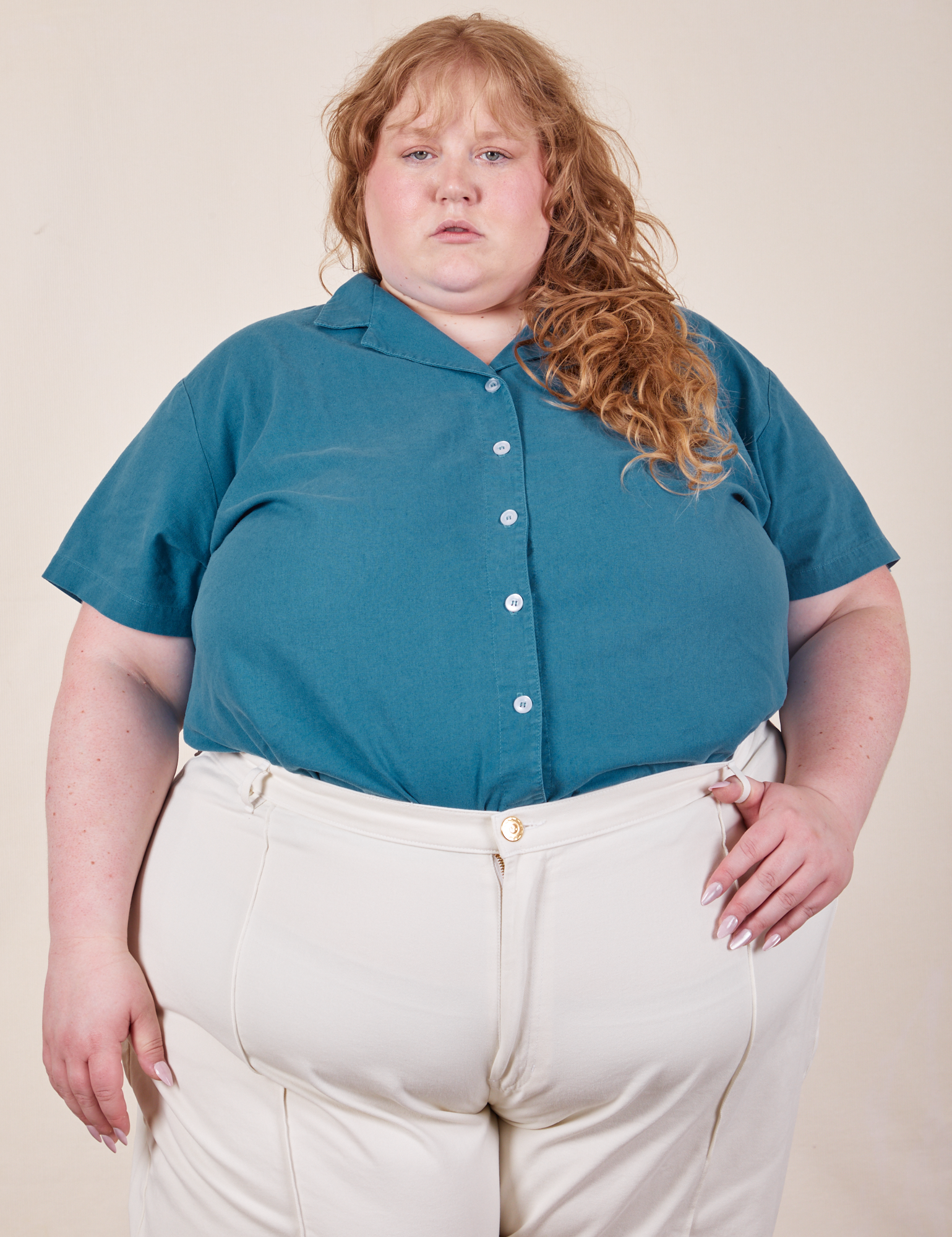 Catie is wearing Pantry Button-Up in Marine Blue tucked into vintage tee off-white Western Pants