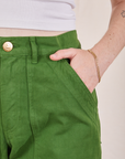 Petite Pencil Pants in Lawn Green front pocket close up. Hana has her hand in the pocket.