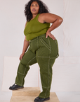 Side view of Railroad Carpenter Jeans in Summer Olive and Muscle Tee on Morgan