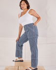 Tiara is wearing Carpenter Jeans in Indigo Railroad and vintage tee off-white Square Neck Tank