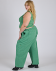 Side view of Drop Pocket Cargo Pants in Seafoam Green and matching Muscle Tee on Juliet