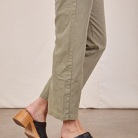 Side pant leg close up of Short Sleeve Jumpsuit in Khaki Grey worn by Alex