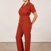 Angled view of Short Sleeve Jumpsuit in Paprika worn by Tiara