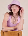 Alex is wearing Wide Brim Denim Bucket Hat in Lilac
