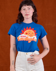Alex is wearing Sunny Los Angeles Tourist Tee tucked into vintage tee off-white Western Pants