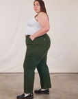 Side view of Work Pants in Swamp Green and Cropped Tank Top in vintage tee off-white on Marielena