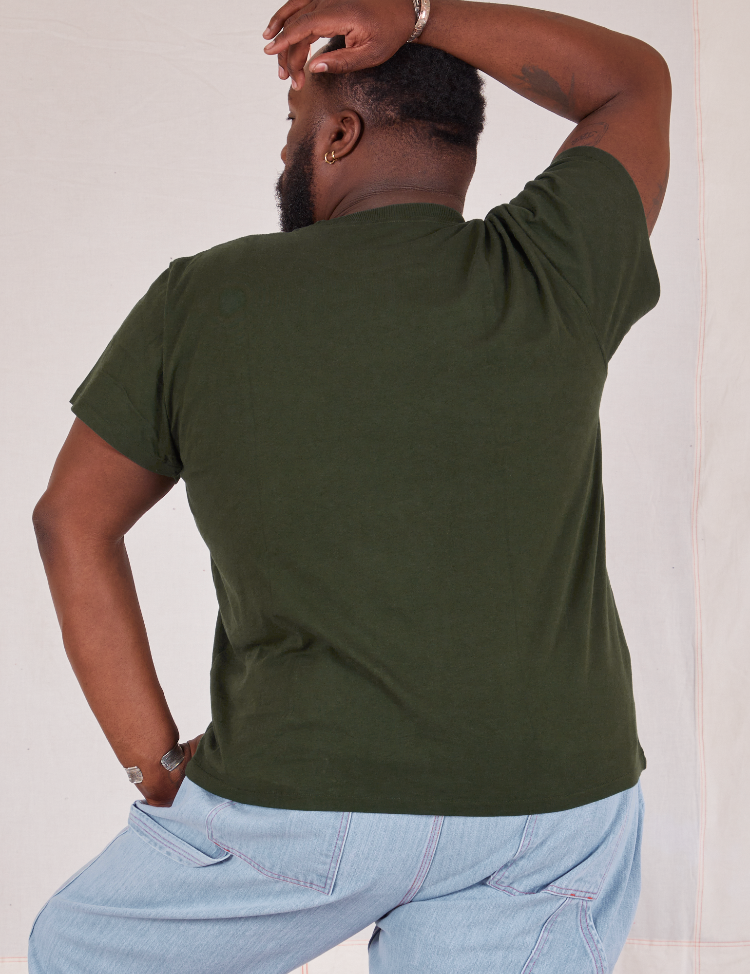 Organic Vintage Tee in Swamp Green back view on Elijah