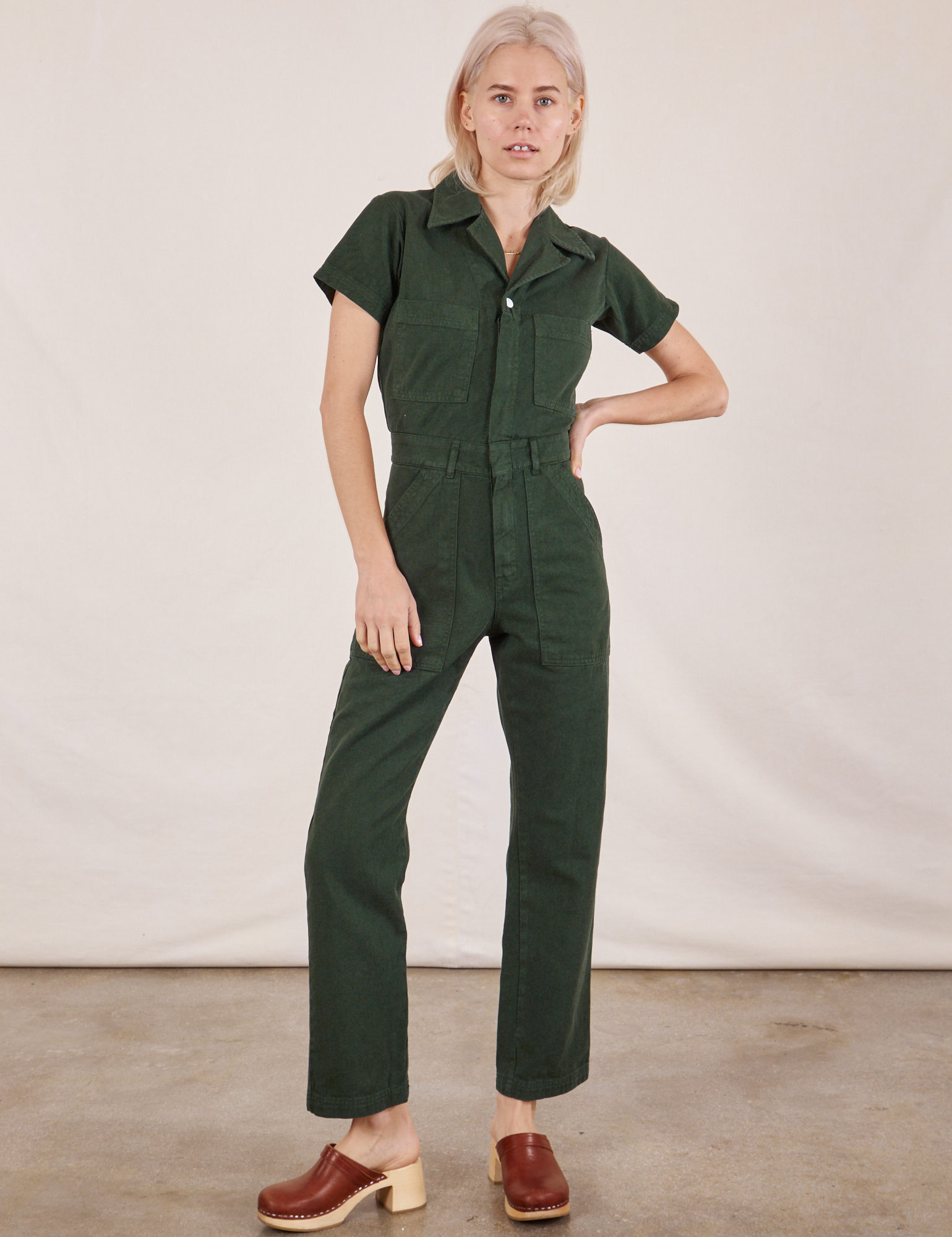Madeline is 5&#39;9&quot; and wearing XXS Short Sleeve Jumpsuit in Swamp Green