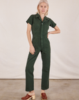 Madeline is 5'9" and wearing XXS Short Sleeve Jumpsuit in Swamp Green