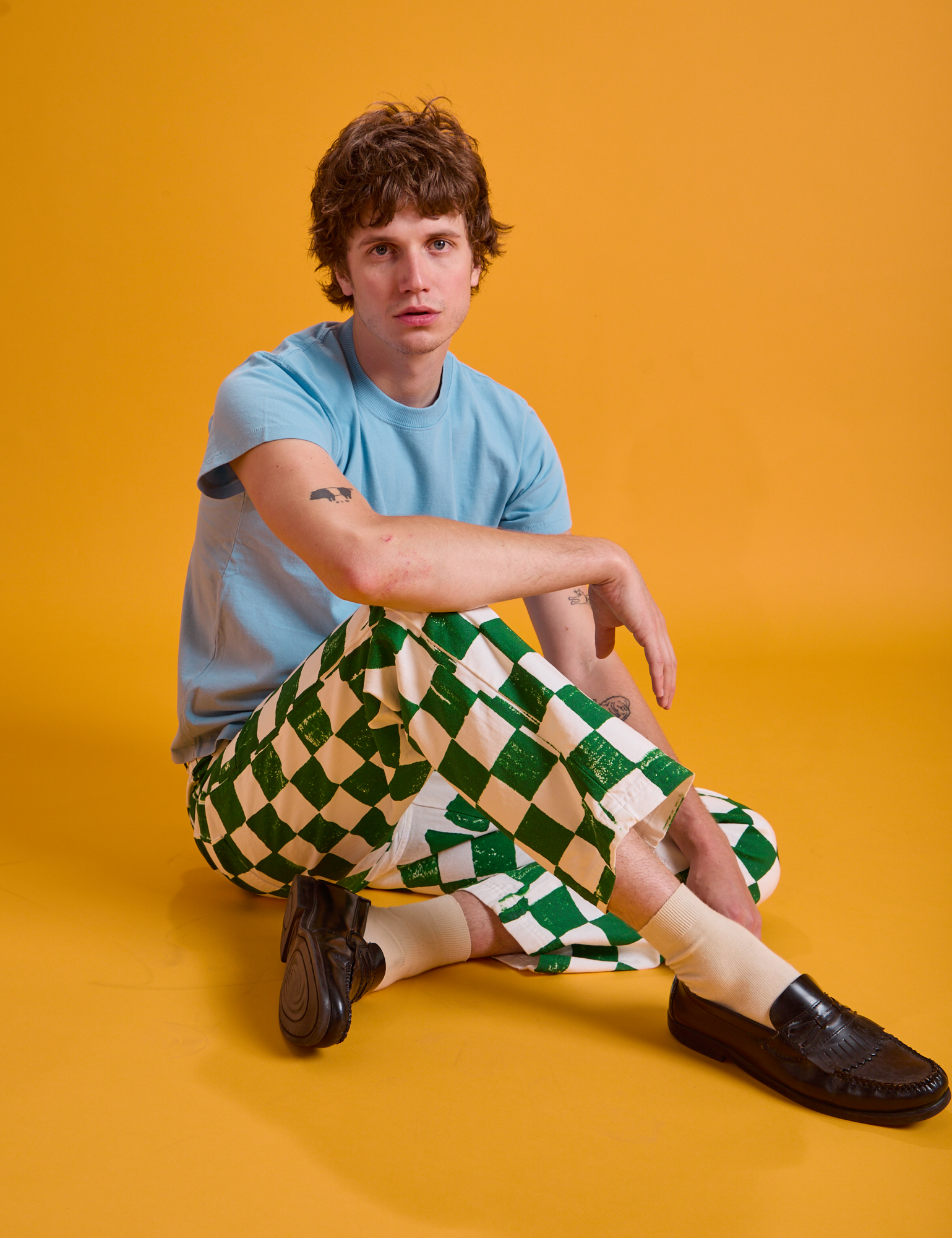 Quinn is wearing Checkerboard Work Pants in White/Green and baby blue Organic Vintage Tee