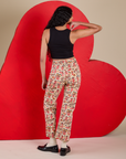 Back view of Work Pants in Hot Stuff Print and black Cropped Tank on Shahana