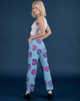 Angled back view of Floral Painted Work Pants in Blue on Madeline