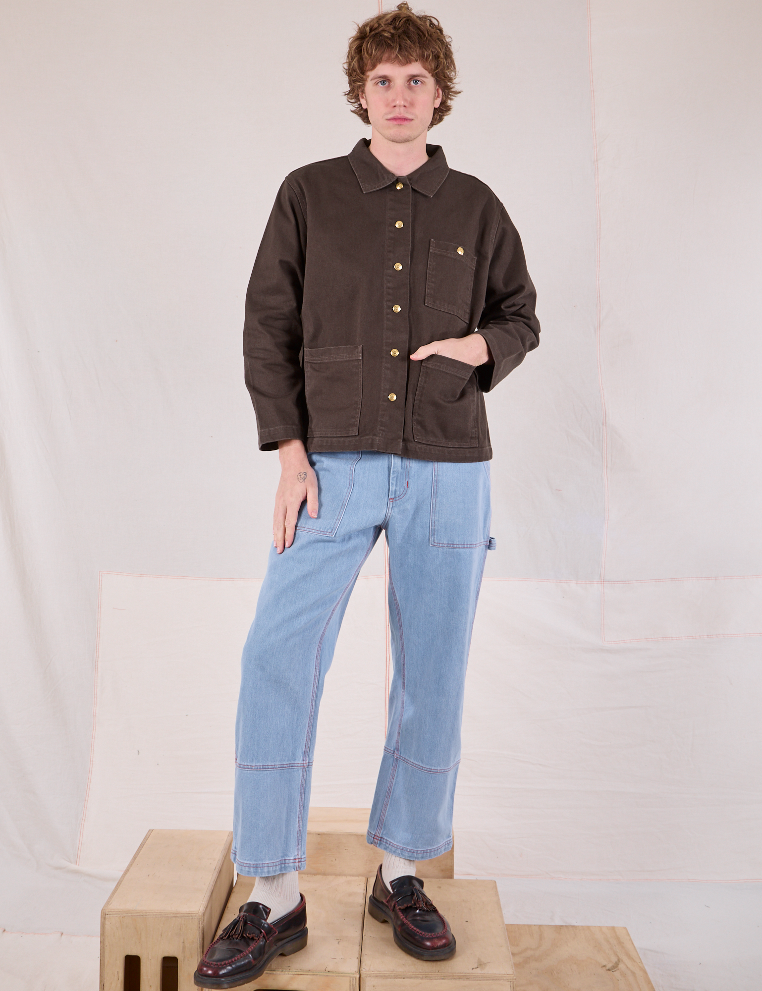 Quinn is wearing Denim Work Jacket in Espresso Brown and light wash Carpenter Jeans