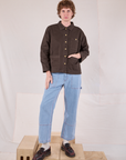 Quinn is wearing Denim Work Jacket in Espresso Brown and light wash Carpenter Jeans