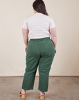 Work Pants in Dark Emerald Green back view on Ashley wearing vintage off-white Baby Tee