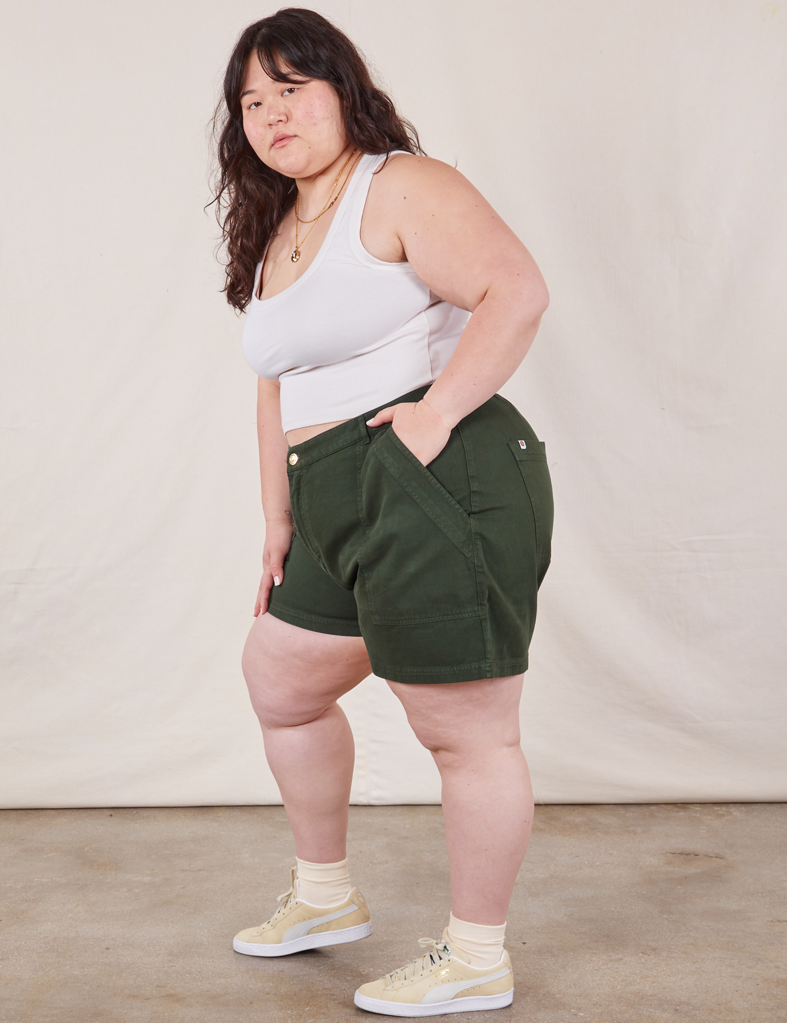 Side view of Classic Work Shorts in Swamp Green and Cropped Tank Top in vintage tee off-white on Ashley