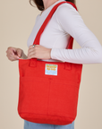 Over-Shoulder Zip Mini Tote in Mustang Red worn on shoulder of model