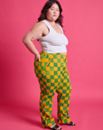 Side view of Checkerboard Work Pants in Green/Yellow and Cropped Tank in Vintage Tee White on Ashley