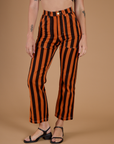 Close up of Black Stripe Work Pants in Construction Orange on Alex