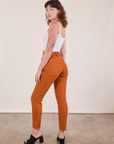 Angled back view of Pencil Pants in Burnt Terracotta on Alex