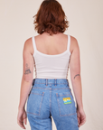 Back view of Cropped Cami in Vintage Off-White and light wash Frontier Jeans worn by Alex