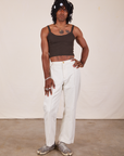 Jerrod is wearing Cropped Cami in Espresso Brown and vintage off-white Western Pants