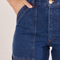 Carpenter Jeans in Dark Wash front pocket close up. Tiara has her hand in the pocket