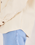 Corduroy Overshirt in Vintage Off-White side close up of curved hem