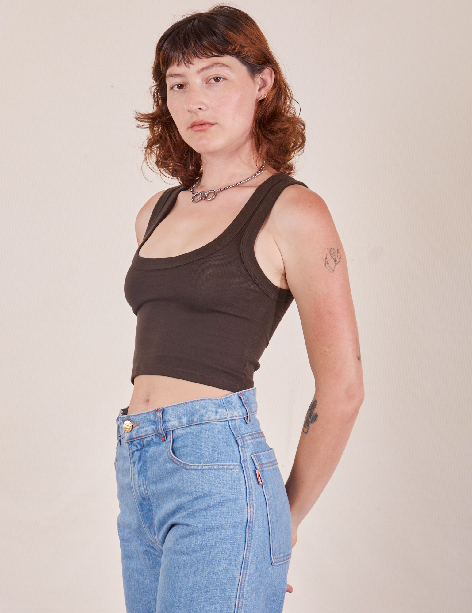 Angled view of Cropped Tank Top in Espresso Brown worn by Alex