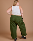 Back view of Drop Pocket Cargo Pants in Evergreen and Cropped Tank in vintage tee white