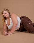 Juliet is wearing Drop Pocket Cargo Pants in Fudgesicle Brown and Cropped Tank in vintage tee white