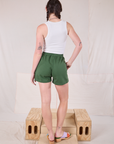 Back view of Easy Shorts in Dark Emerald Green and Cropped Tank in vintage tee off-white on Aelx