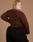 Long Sleeve Baby Tee in Fudgesicle Brown angled back view on Juliet
