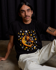 Anthony is wearing Vintage Tee in Moon & Witch