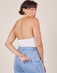 Back view of Halter Top in Vintage Tee Off-White and light wash Sailor Jeans worn by Tiara