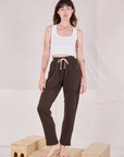 Alex is 5'8" and wearing P Rolled Cuff Sweat Pants in Espresso Brown paired with Cropped Tank in vintage tee off-white