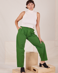 Tiara is 5'4" and wearing S Heavyweight Trousers in Lawn Green paired with Sleeveless Turtleneck in vintage tee off-white