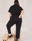 Heritage Short Sleeve Jumpsuit in Basic Black back view on Katie