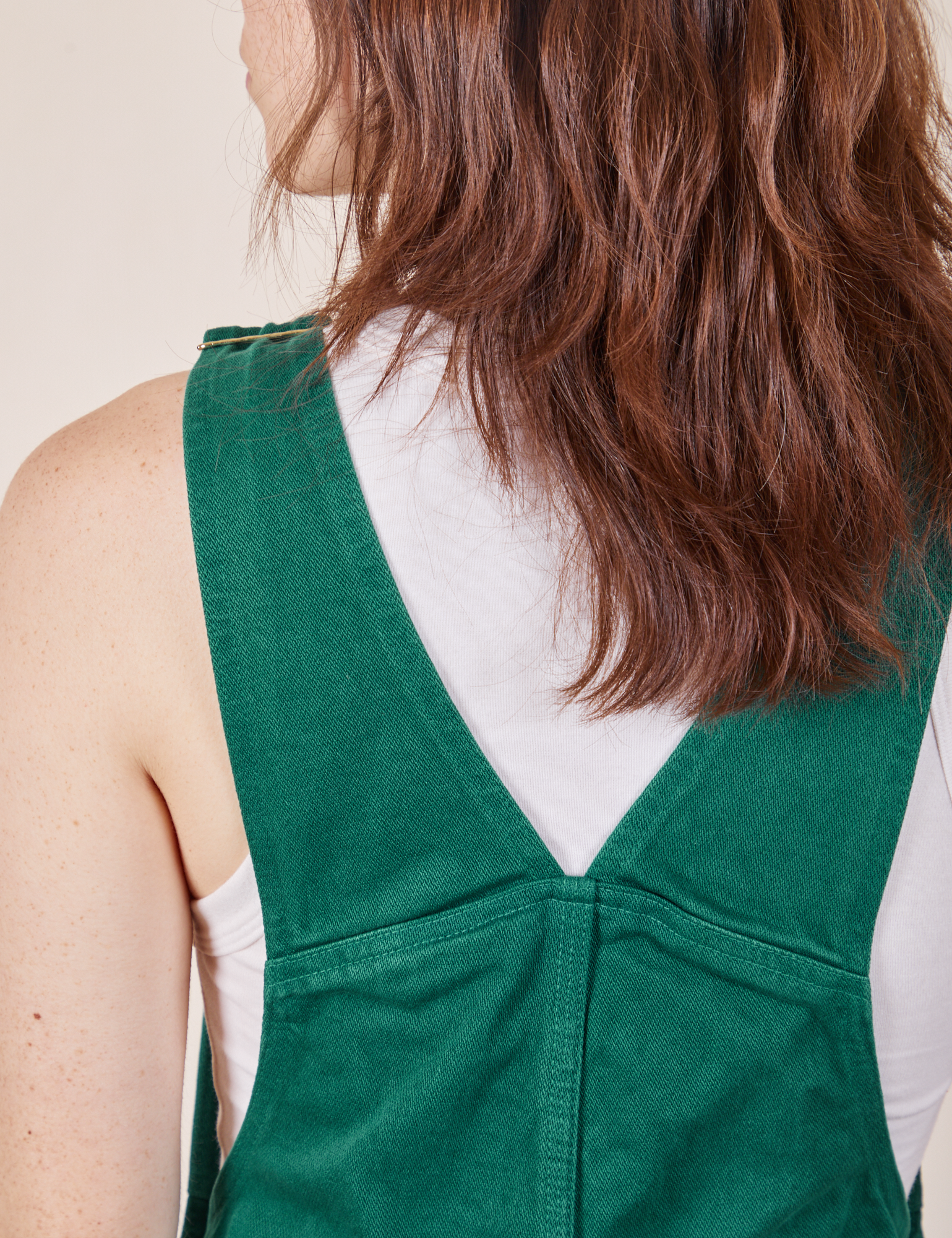 Back close up of Original Overalls in Mono Hunter Green worn by Hana