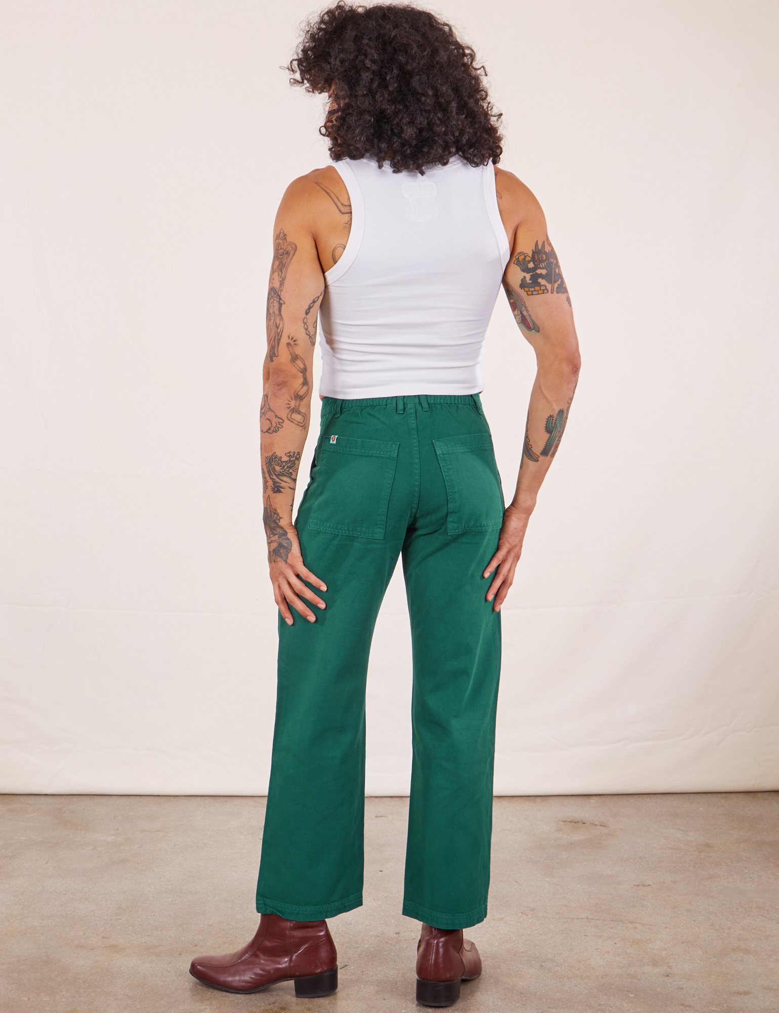 Back view of Work Pants in Hunter Green worn by Jesse