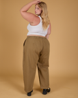 Baggy Mid-Rise Trousers in Desert Brown angled back view on Juliet