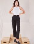 Alex is 5'8" and wearing XXS Organic Work Pants in Basic Black paired with a Racerback Tank in vintage tee off-white