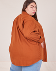 Angled back view of Oversize Overshirt in Burnt Terracotta worn by Marielena