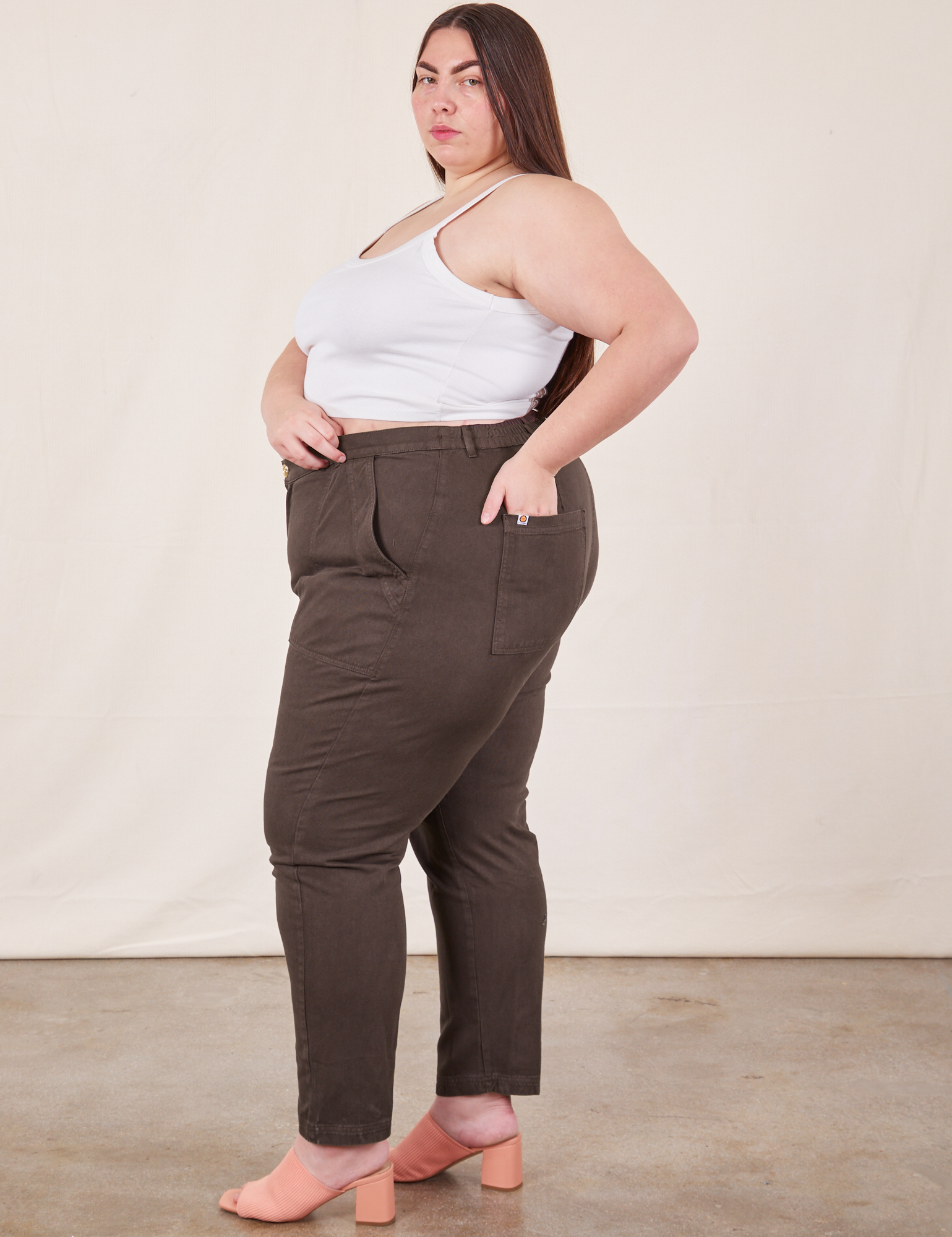 Side view of Pencil Pants in Espresso Brown and Cropped Cami in vintage tee off-white on Marielena