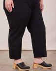 Pant leg close up of Petite Short Sleeve Jumpsuit in Basic Black worn by Ashley