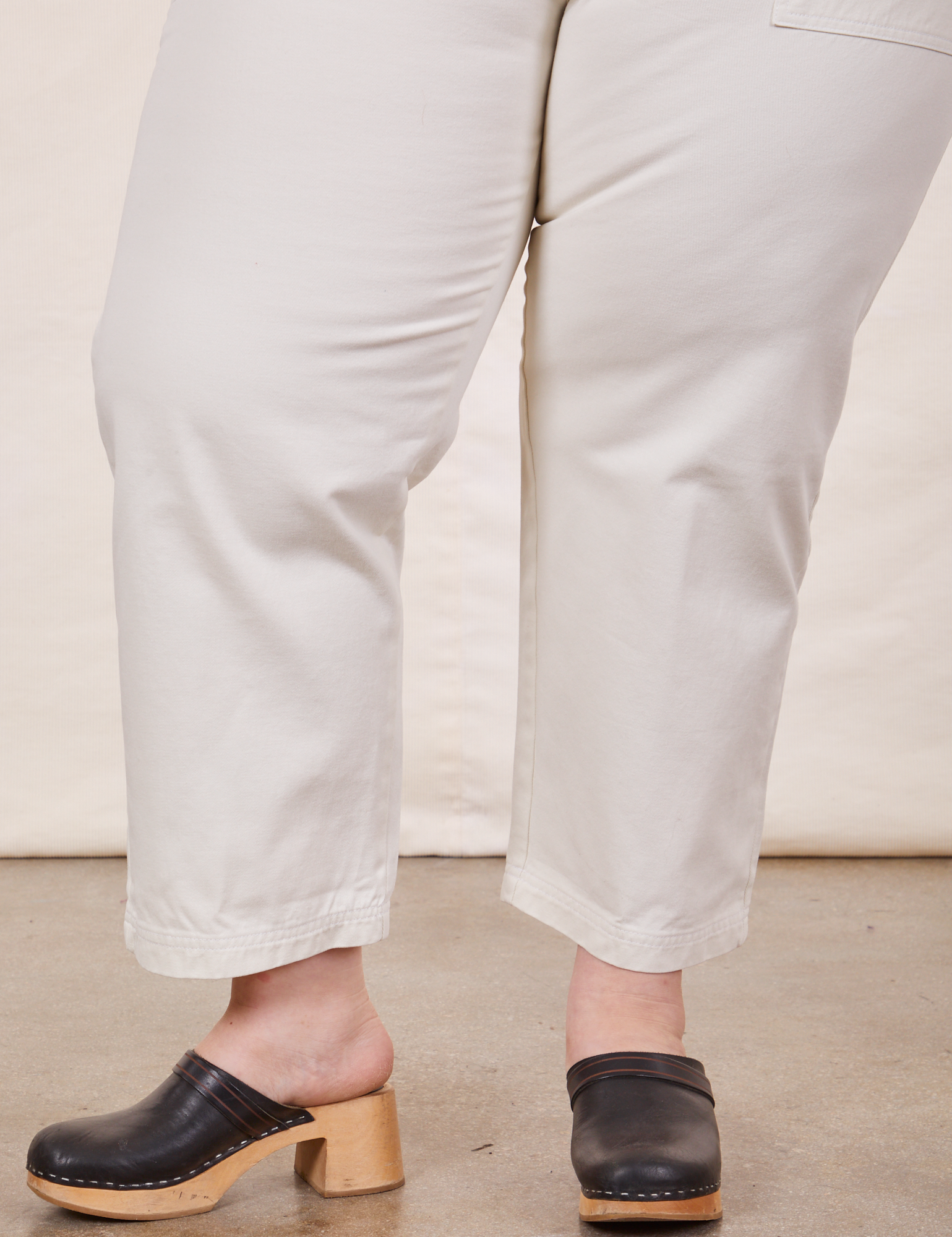 Pant leg close up of Petite Short Sleeve Jumpsuit in Vintage Tee Off-White on Ashley
