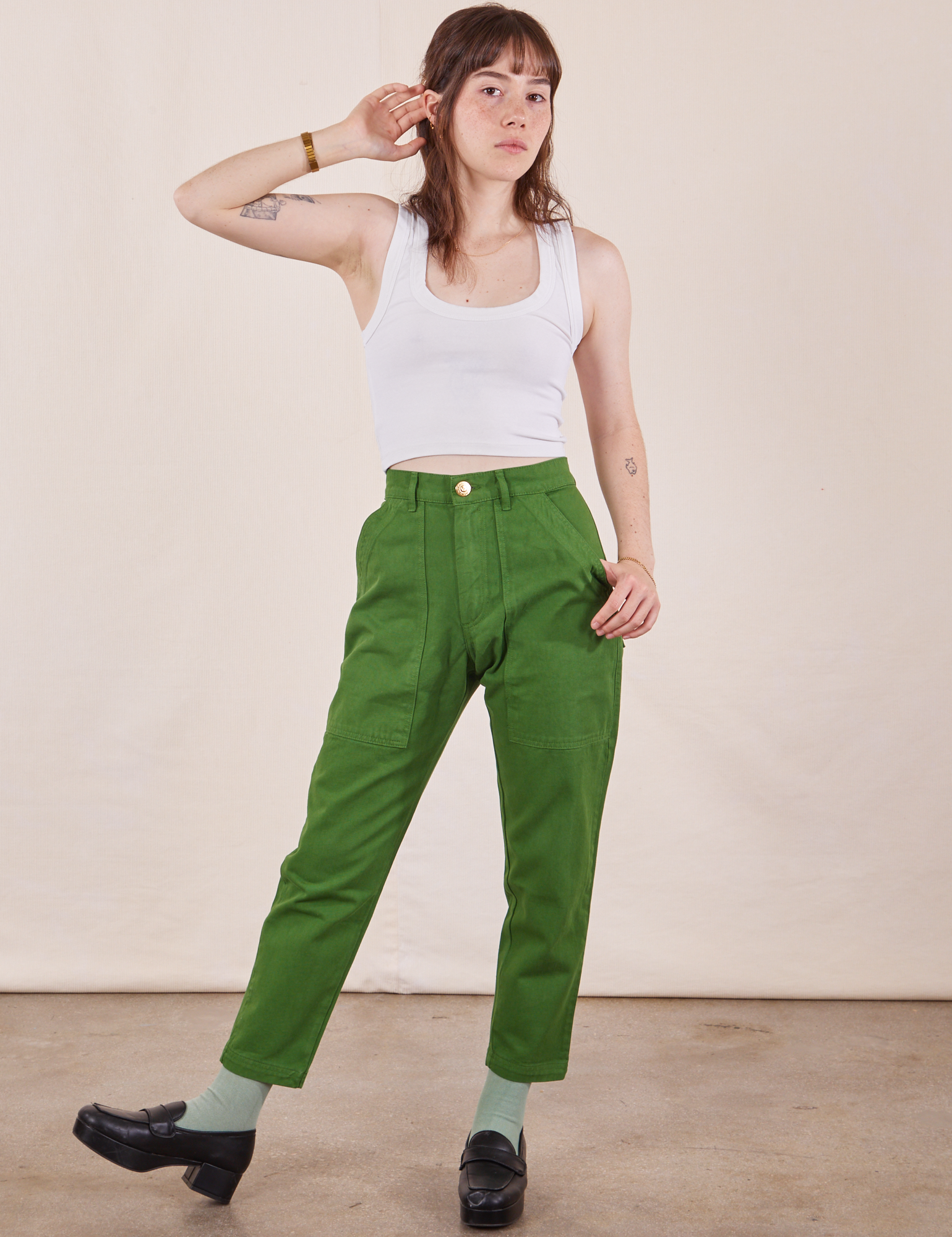 Hana is wearing Petite Pencil Pants in Lawn Green and Cropped Tank Top in vintage tee off-white 