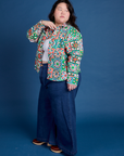 Side view of Cropped Overshirt in Quilt Print and dark wash Indigo Wide Leg Trousers