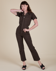 Alex is 5'8" and wearing XS Short Sleeve Jumpsuit in Espresso Brown