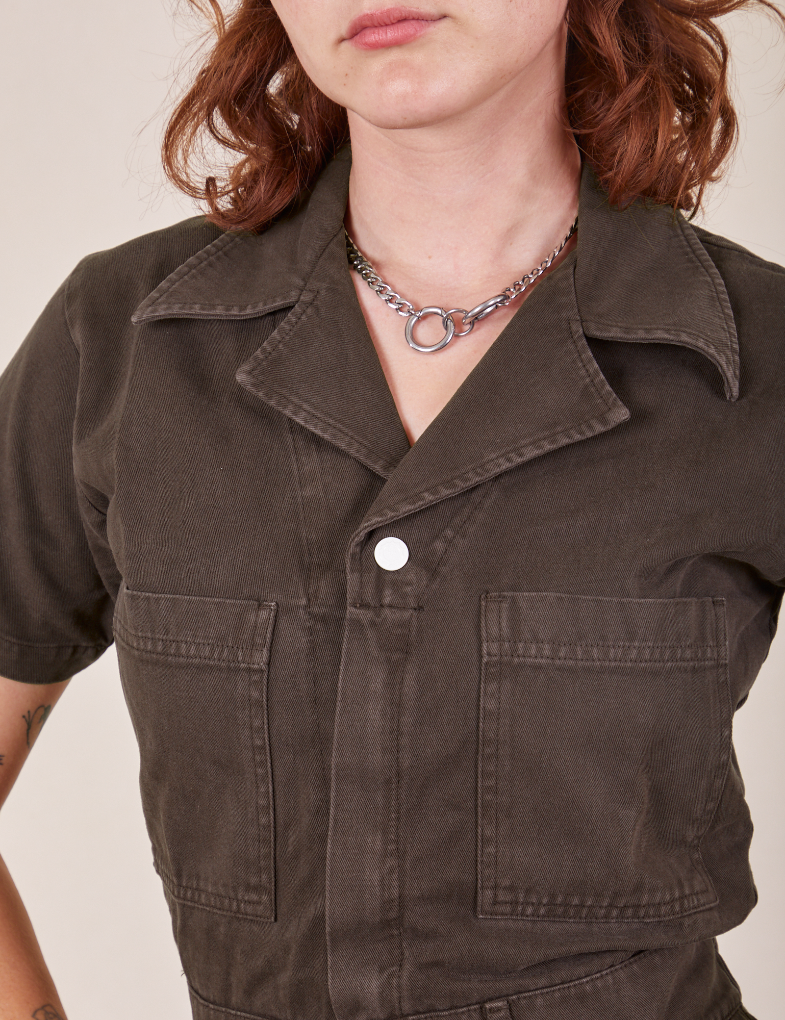 Front close up of Short Sleeve Jumpsuit in Espresso Brown worn by Alex